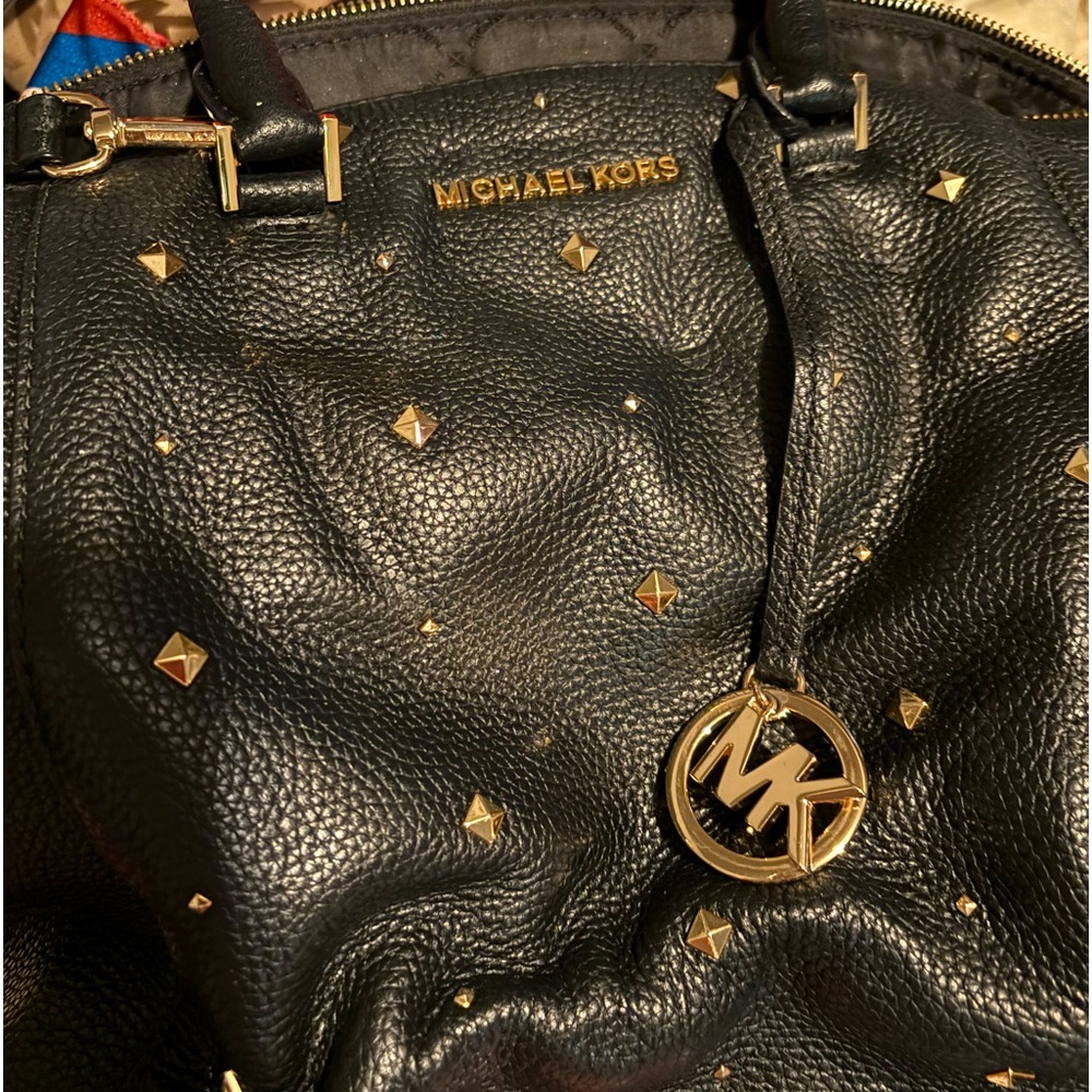 Black Leather Michel Kors  purse with silver studs. In great condition